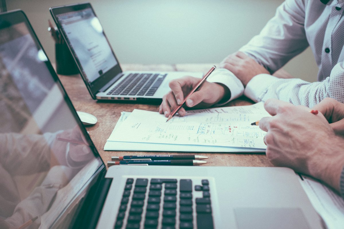 Banking and finance professionals reviewing reports