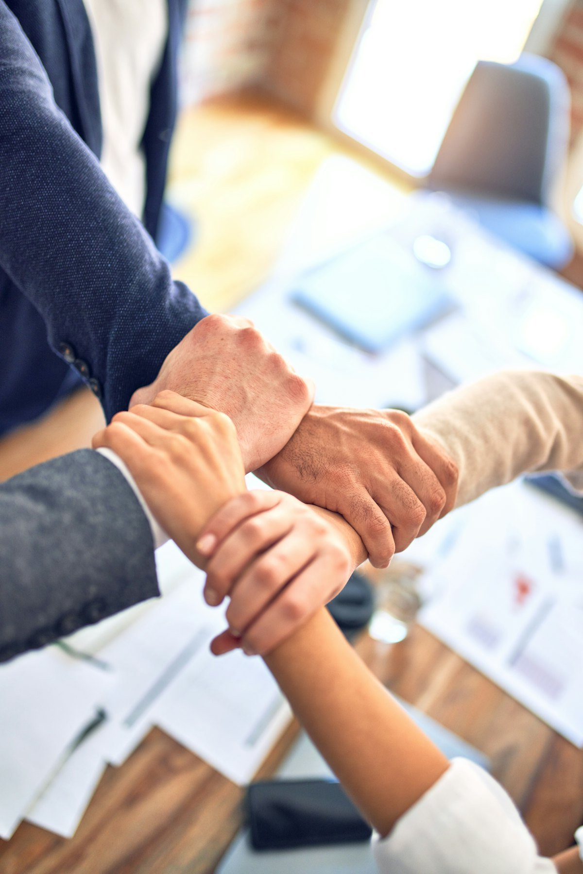 Team hands joined together showing partnership